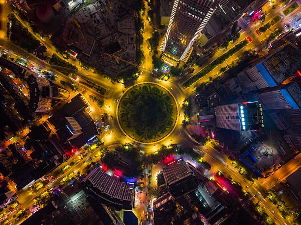 Chinese urban street with fast cars and motion blur reflecting jipinfeiche meaning